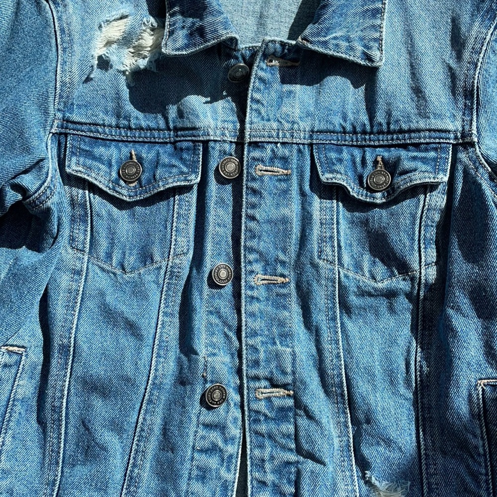 Women’s distressed jean jacket